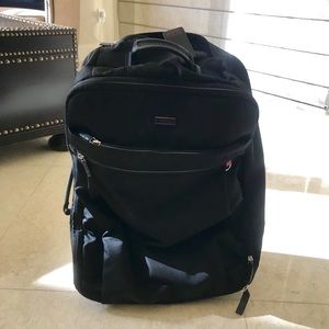 Tumi Voyageur nylon carry-on suitcase